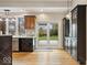 Kitchen features patio access, stainless dishwasher, and beautiful backyard view at 1234 E 71St St, Indianapolis, IN 46220
