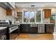 Well-appointed kitchen with stainless steel appliances, a farmhouse sink, and modern cabinetry and countertops at 1234 E 71St St, Indianapolis, IN 46220
