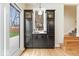 Butler's pantry features beverage cooler, shelving, storage cabinets, and backyard views at 1234 E 71St St, Indianapolis, IN 46220