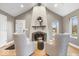 Cozy living room with stone fireplace, vaulted ceiling, and natural light at 1234 E 71St St, Indianapolis, IN 46220