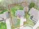 Aerial shot outlining property boundaries, showing landscaping and neighborhood homes at 130 George Ct, Danville, IN 46122