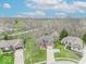 Stunning aerial view of a suburban neighborhood featuring well-maintained homes and lush greenery at 130 George Ct, Danville, IN 46122