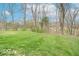 Expansive backyard featuring a well-manicured lawn and mature trees at 130 George Ct, Danville, IN 46122