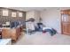 Spacious carpeted basement features a home gym, desk, and sitting area at 130 George Ct, Danville, IN 46122