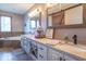 Beautiful bathroom with double vanity, farmhouse mirror, and a bathtub at 130 George Ct, Danville, IN 46122
