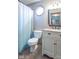 Well-maintained bathroom includes a decorative mirror, vanity, and toilet at 130 George Ct, Danville, IN 46122