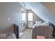 Charming bedroom with a cozy bed, neutral walls, and sloped ceilings at 130 George Ct, Danville, IN 46122