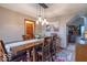 Cozy dining area featuring a wood table, stylish lighting, and a seamless flow to the living space at 130 George Ct, Danville, IN 46122