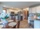 Beautiful kitchen with granite countertops, stainless appliances, and adjacent breakfast area with backyard views at 130 George Ct, Danville, IN 46122