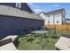 Inviting backyard oasis featuring comfortable seating arrangement and artificial turf for relaxation at 1321 Union St, Indianapolis, IN 46225