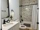 Stylish bathroom featuring a marble shower with updated fixtures and a modern vanity at 1321 Union St, Indianapolis, IN 46225