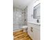 Bathroom featuring a sleek sink and frameless glass shower with decorative tile at 1321 Union St, Indianapolis, IN 46225