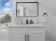 The bright bathroom features a sleek vanity with modern fixtures and countertop decor, set against a window with natural light at 1321 Union St, Indianapolis, IN 46225