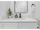 Modern bathroom with white vanity, a black faucet, and a minimalist design at 1321 Union St, Indianapolis, IN 46225