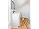 Bathroom featuring modern sink and mirror, toilet, and decorative tile in the shower at 1321 Union St, Indianapolis, IN 46225