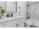 Modern bathroom features white marble, a sleek black faucet, and a mirror at 1321 Union St, Indianapolis, IN 46225