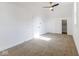 Bright bedroom features neutral carpet, white walls, a gold ceiling fan, and ample closet space at 1321 Union St, Indianapolis, IN 46225