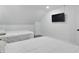 Modern bedroom with two beds and a wall-mounted TV creating a comfortable and tech-ready space for relaxation and entertainment at 1321 Union St, Indianapolis, IN 46225