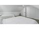Bright bedroom showcases two twin beds, neutral carpet, and clean white walls that provides a serene retreat at 1321 Union St, Indianapolis, IN 46225