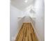 Walk-in closet with ample shelving and wood flooring at 1321 Union St, Indianapolis, IN 46225