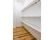 Walk in closet featuring an open shelving and luxury vinyl plank flooring at 1321 Union St, Indianapolis, IN 46225