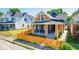 Attractive home exterior with a lush front yard, new wooden fence, and newly painted siding and trim at 1321 Union St, Indianapolis, IN 46225