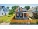 Beautiful exterior of a two-story home featuring manicured landscaping, a new fence, and fresh paint at 1321 Union St, Indianapolis, IN 46225