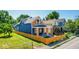 Charming home with well-manicured lawn, blue siding, and a striking orange fence at 1321 Union St, Indianapolis, IN 46225