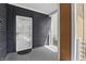 Stylish home exterior featuring a modern front door and porch, with a mix of siding and architectural details at 1321 Union St, Indianapolis, IN 46225