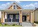 Inviting front porch with modern railing and freshly painted porch, adding to the home's charm at 1321 Union St, Indianapolis, IN 46225
