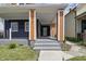 Inviting front porch with painted concrete steps, columns, and plenty of space to relax at 1321 Union St, Indianapolis, IN 46225