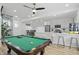 Spacious game room with a pool table, bar seating, and a stylish kitchenette at 1321 Union St, Indianapolis, IN 46225