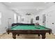Open floor plan game room featuring a pool table, leading into a comfy living room at 1321 Union St, Indianapolis, IN 46225
