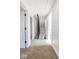 Carpeted hallway with white walls and trim, doors to rooms, and a staircase at 1321 Union St, Indianapolis, IN 46225