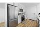 Bright kitchen featuring stainless steel appliances, white cabinets, and modern countertops at 1321 Union St, Indianapolis, IN 46225