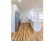 A kitchen featuring an island, white cabinets, stainless steel appliances, and wood flooring at 1321 Union St, Indianapolis, IN 46225