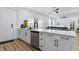 Modern kitchenette featuring white cabinets, stainless steel appliances and breakfast bar at 1321 Union St, Indianapolis, IN 46225