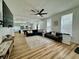 Bright living room featuring hardwood floors, ceiling fan, and comfortable sofas at 1321 Union St, Indianapolis, IN 46225