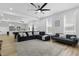 Open-concept living room has hardwood floors and comfortable seating near the kitchen at 1321 Union St, Indianapolis, IN 46225
