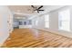 Sunlit living room showcases hardwood floors, an open floor plan, and large windows for natural light at 1321 Union St, Indianapolis, IN 46225