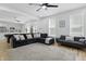 Open-concept living room with hardwood floors, ceiling fan, and comfortable seating at 1321 Union St, Indianapolis, IN 46225