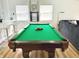 Brightly lit pool table with balls racked and ready for a game at 1321 Union St, Indianapolis, IN 46225