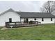 Large deck for outdoor dining and entertaining overlooks a spacious backyard at 13440 E 166Th St, Noblesville, IN 46060