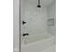 Stylish bathroom with modern showerhead and tiled surround at 1360 N Dearborn St, Indianapolis, IN 46201