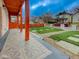 Inviting front porch featuring patterned tiles and a well-manicured lawn at 1360 N Dearborn St, Indianapolis, IN 46201