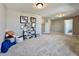 Spacious upper bonus room featuring neutral colors and carpet, with playful decor and ample space at 1380 Delacorte Cir, Shelbyville, IN 46176