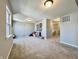 A large bonus room with soft carpeting, neutral walls, and plenty of natural light at 1380 Delacorte Cir, Shelbyville, IN 46176