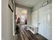 Inviting entryway with storage bench and convenient access to bonus room at 1380 Delacorte Cir, Shelbyville, IN 46176