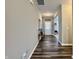 Bright hallway featuring durable flooring leading to the front entrance at 1380 Delacorte Cir, Shelbyville, IN 46176