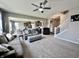 Open-concept living area seamlessly connects the living room, dining area, and kitchen creating a cohesive and modern living space at 1380 Delacorte Cir, Shelbyville, IN 46176